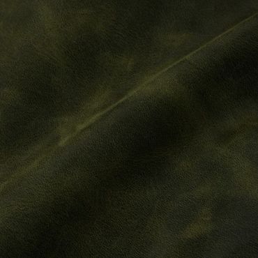 Close-up of dark green leather texture with natural grain.