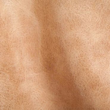 Close-up of textured beige leather material.