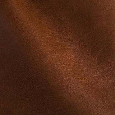Close-up of brown leather texture with natural creases.