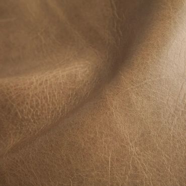 Close-up of textured brown leather material.