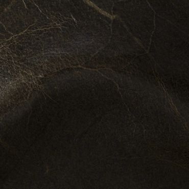 Close-up of dark brown leather texture with natural creases.