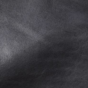 Close-up of textured black leather surface.