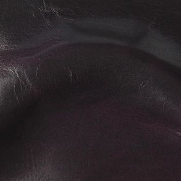 Close-up of textured dark leather material with natural creases.