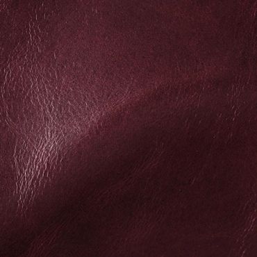 Close-up of smooth burgundy leather texture with subtle shine.
