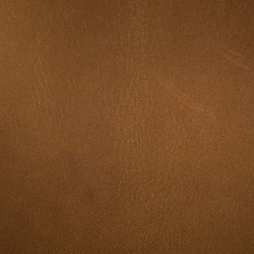 Close-up of brown leather texture with subtle grain patterns.