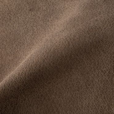 Close-up of textured brown leather surface.