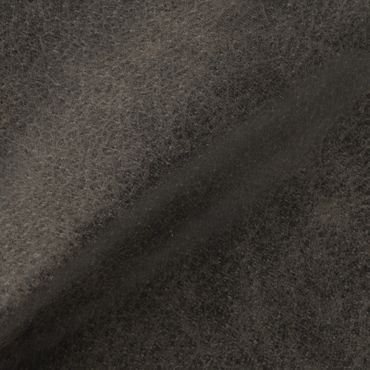 Close-up of dark, textured fabric with a soft, fuzzy surface.