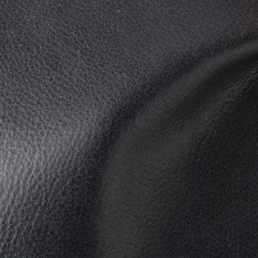 Close-up of textured black leather fabric with natural folds.
