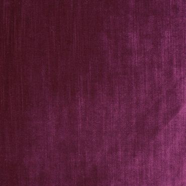 Close-up of rich purple velvet fabric texture.