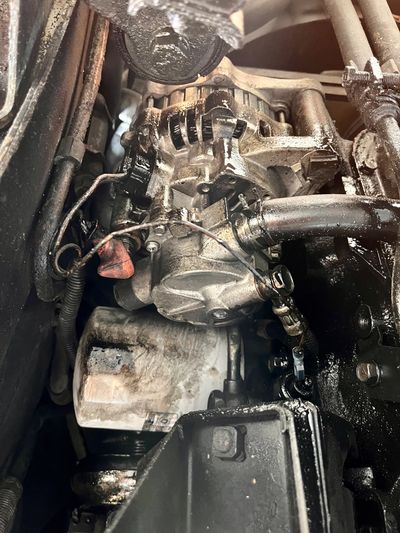 Oily mess from loose Mitsubishi Delica rocker cover gasket done by Nomadic Vans in Ketchum Idaho.