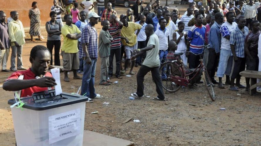 Voter places ballot in the ballot box at the polling station