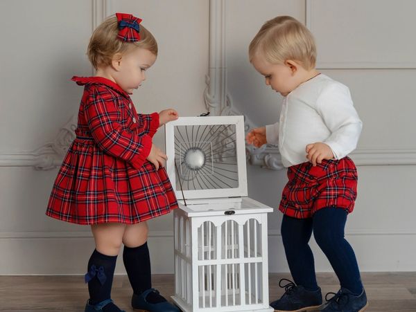 Are two kids looking On the table