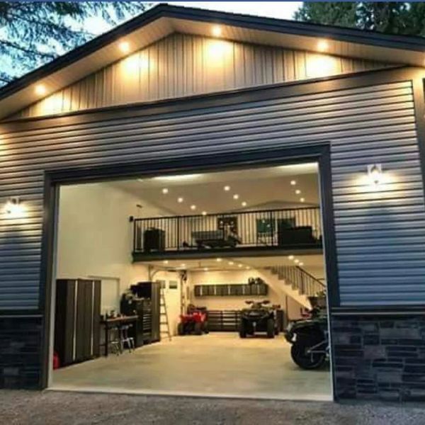 Modern garage with mezzanine and lighting.