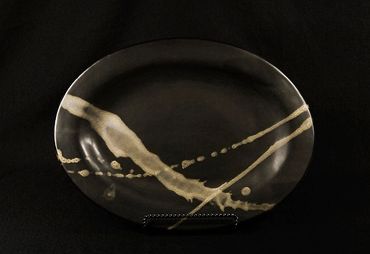 a black color plate by Raspberry Woods Art Studio