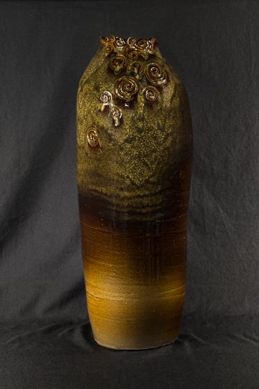 a vase by Raspberry Woods Art Studio
