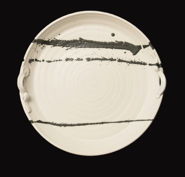 a white color plate by Raspberry Woods Art Studio