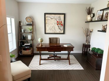 Organized home office with wooden desk and Florida map.