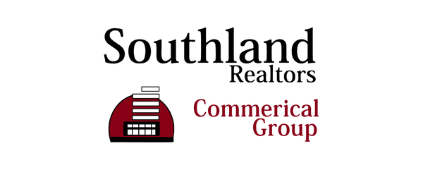 Logo for Commerical Group with a red building icon and text.