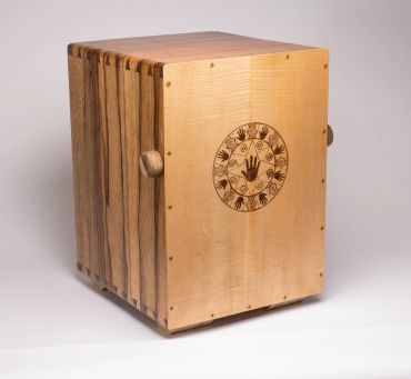 Wooden percussion instrument with decorative carvings.