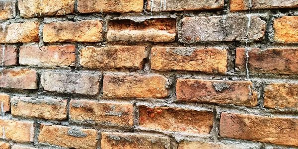 damaged clay bricks wall