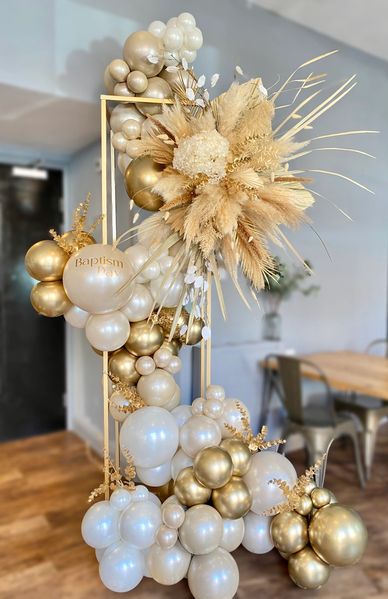 Balloon arch with a floral arrangement in Sussex, Surrey & Kent