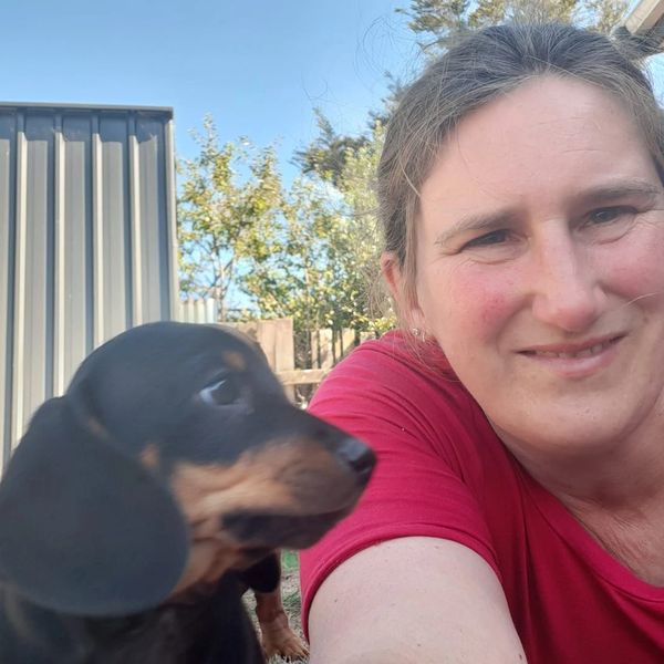 Woman and Dog in the back yard