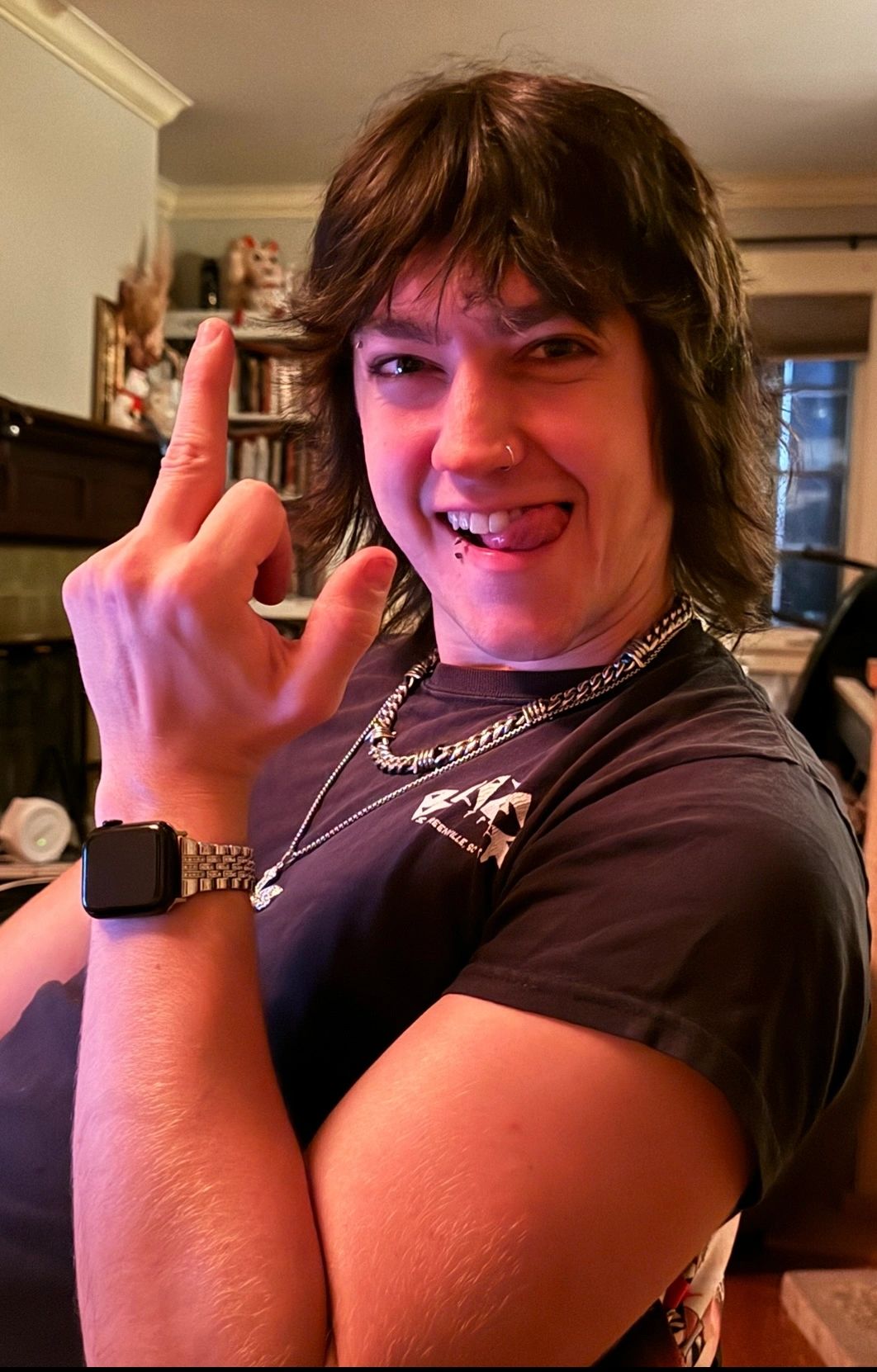 Person making a playful face and gesture.