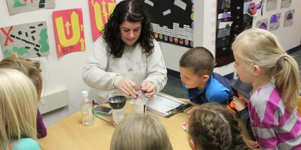 Teacher Brooke is helping Pre-K children explore science!