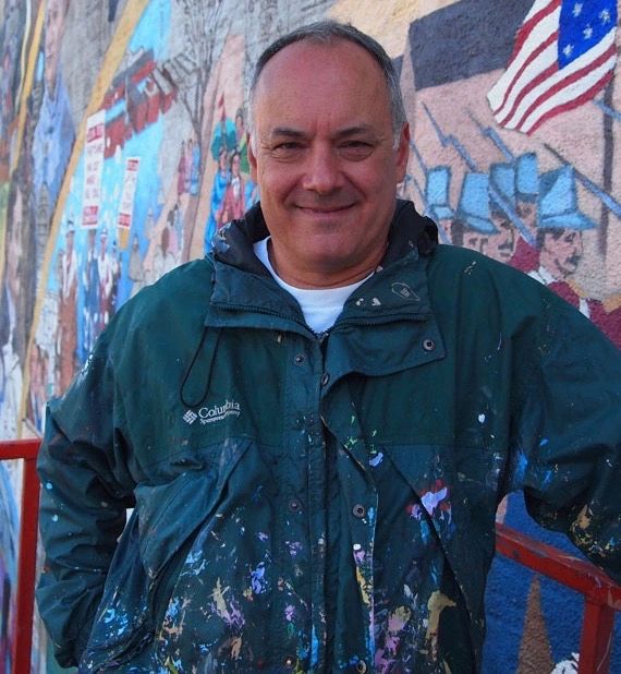 Joshua C. Winer working on the Lynn Stories Mural
