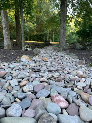 1-3 inch river rock walkway/dry creek