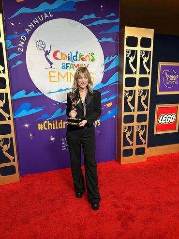 Heather Laura Gray at the C&F Emmy's holding the award for Outstanding Choreography for Monster High.