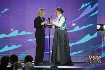 Heather Laura Gray on stage receiving the Emmy for Outstanding Choreography for Monster High.