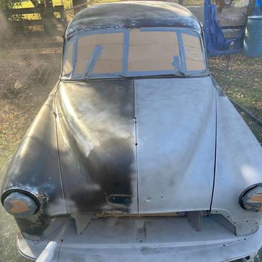 Before and after sandblasted car