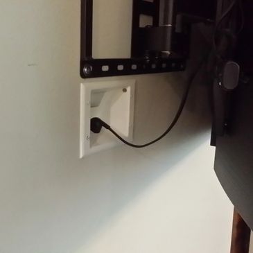 An in wall power cable outlet
