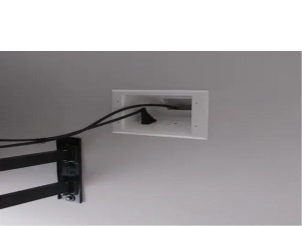 A power relocation outlet behind a tv bracket. 