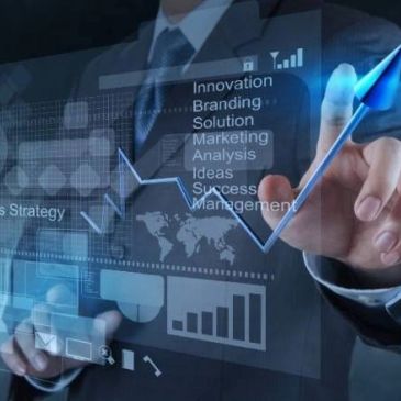 Business person interacting with virtual financial graphs.
