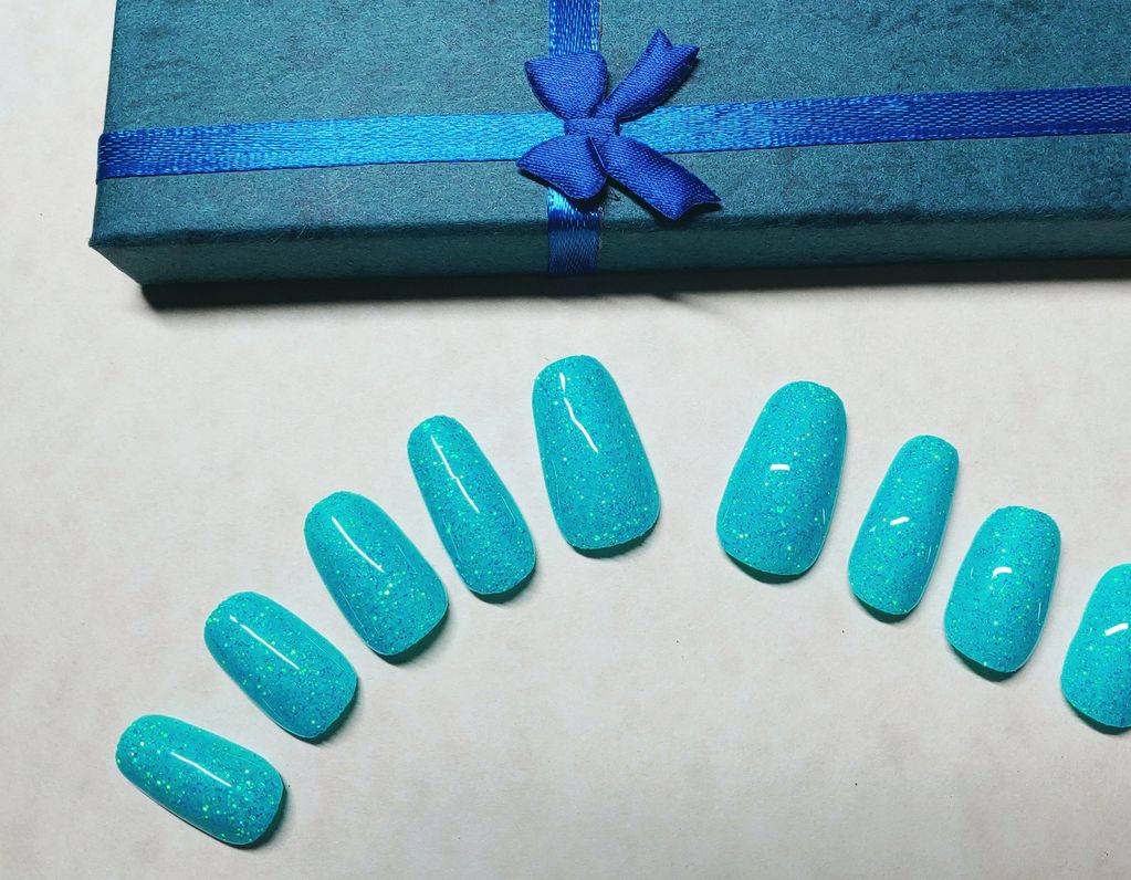 Glacial Blue Glitter Nails are made with real glitter and gel top coated with multiple layers.