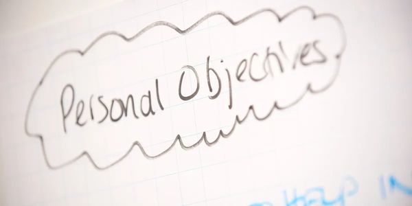 A personal objective written in black ink on paper.