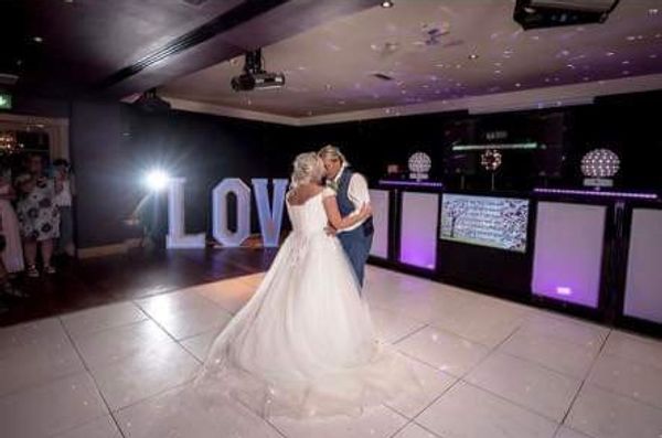 Wedding first dance with unique DJ setup with large Light up love letters 