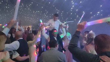 party crowd having an amazing time on the dancefloor