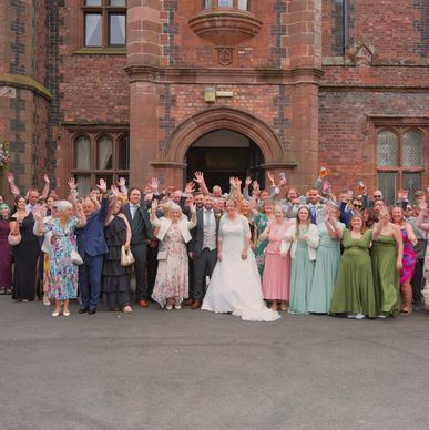 all guests at a wedding photo portrait outside the entrance of Walton Hall Warrington Cheshire weddi