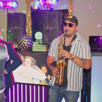Sax player at a wedding in Walton Hall Warrington Cheshire