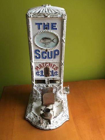 The Scup Antique Match Machine made by the Northwestern Corp. 
Sellem Antique Match Machine