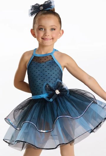 Young girl in a blue tutu dress with bow.