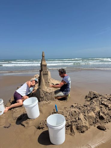 Sandcastle on the beach with waves south padre island scott dodson and Terri Robinson