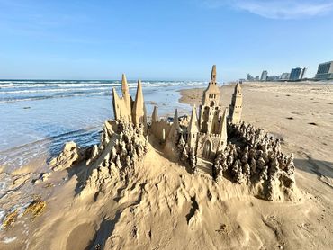 Sandcastle on the beach with waves south padre island scott dodson sand castle