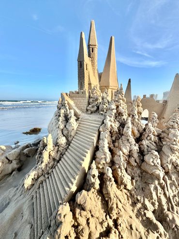Sandcastle on the beach with waves south padre island scott dodson sand castle