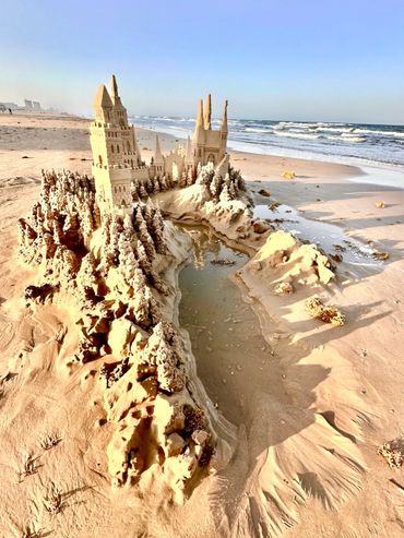 Sandcastle on the beach with waves south padre island scott dodson sand castle