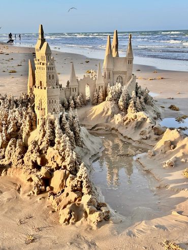 Sandcastle on the beach with waves south padre island scott dodson sand castle