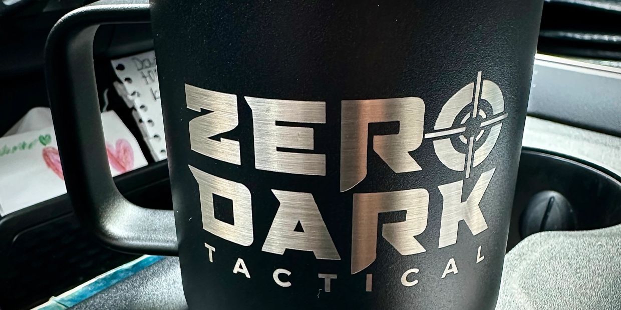 Black mug with 'ZERO DARK TACTICAL' text and a targeting symbol.